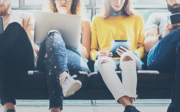 Group,Adult,Hipsters,Friends,Sitting,Sofa,Using,Modern,Gadgets.business,Startup